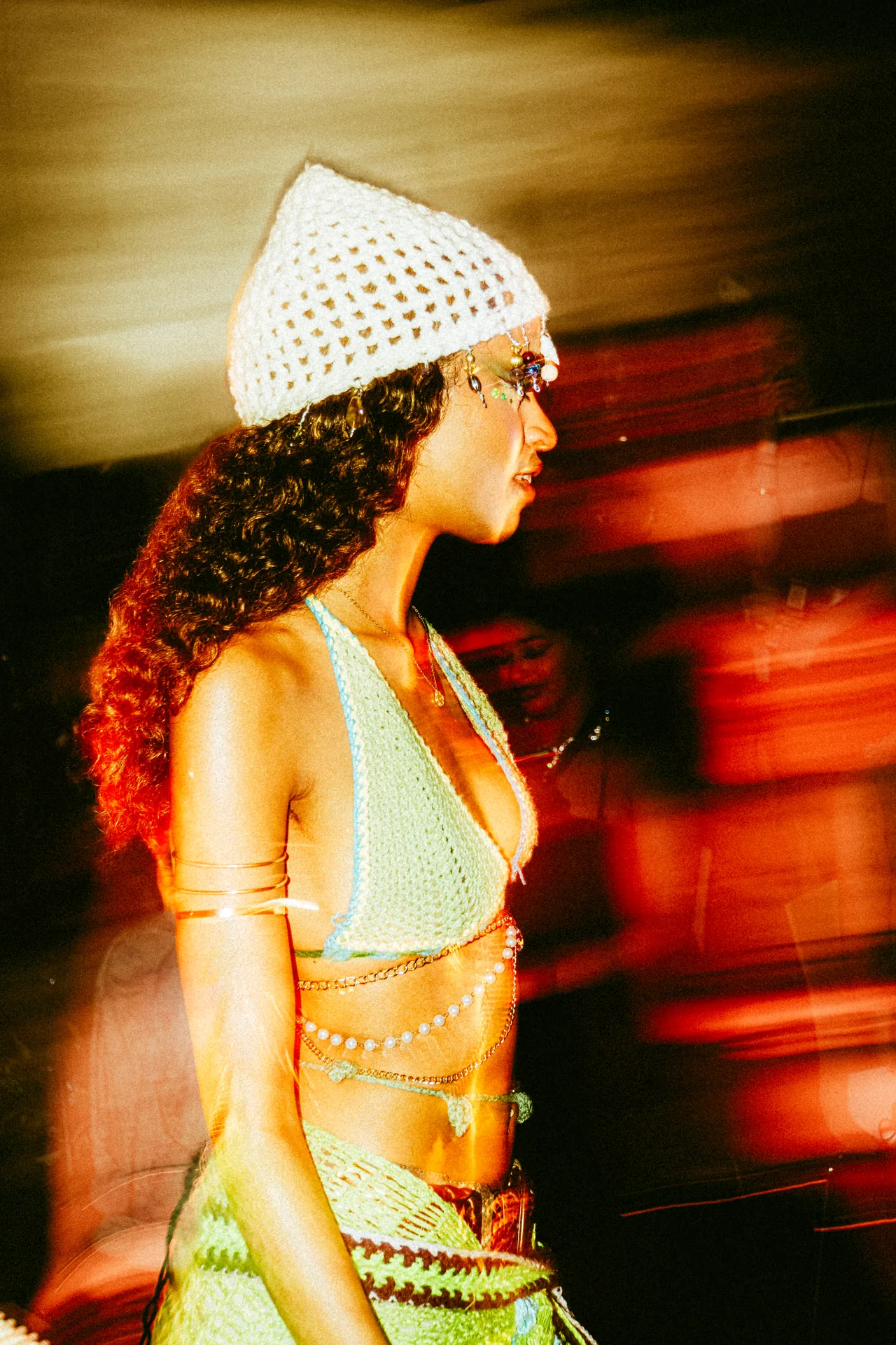 Model walking the runway at CEL3BRATION 2025, photographed in motion